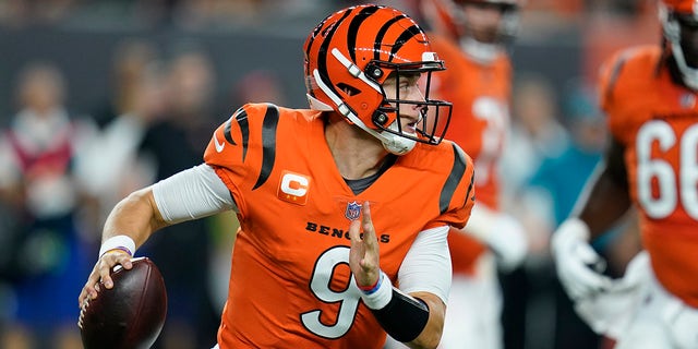 Cincinnati Bengals quarterback Joe Burrow (9) looks to throw during the first half of an NFL football game against the Jacksonville Jaguars, Thursday, Sept. 30, 2021, in Cincinnati.