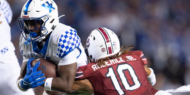 South Carolina defensive back R.J. Roderick (10) tackles Kentucky running back Kavosiey Smoke (0) in the second half of an NCAA college football game. Saturday, Sept. 25, 2021, at Williams-Brice Stadium in Columbia, S.C.
