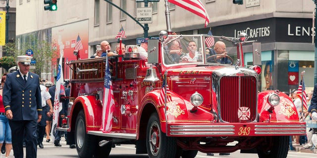 Many cities across the United States have parades on Labor Day. Pictured here are members of New York City Fire Department with a classic Mack Engine 343, marching toward north on 5th Avenue in New York City.
