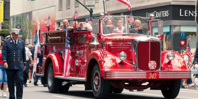 Many cities across the United States have parades on Labor Day. Pictured here are members of New York City Fire Department with a classic Mack Engine 343, marching toward north on 5th Avenue in New York City.