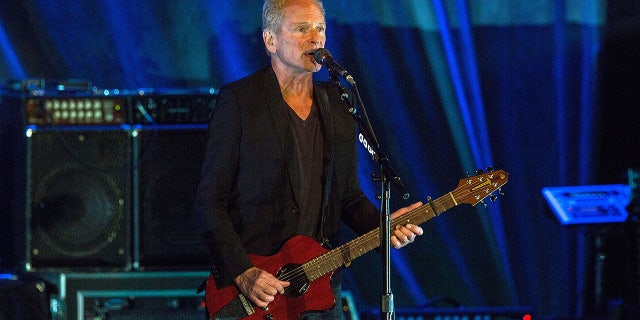 Buckingham is set to release a self-titled solo album on Friday and said that some of his songs took on new meaning amid his marital struggles.