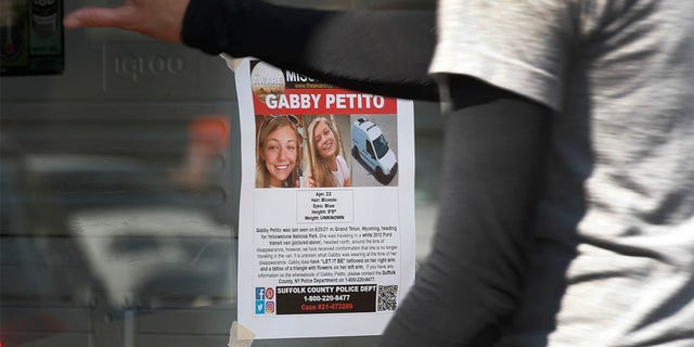 A flyer of Gabby Petito who is missing, hangs on the door of a store as customers enter in Jackson, Wyoming on September 16, 2021.  Photo by George Frey