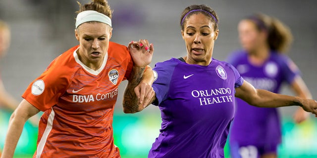 Orlando Pride forward Sydney Leroux (2), right, and Houston Dash midfielder Mana Shim (12) fight for the ball during the soccer match between the Orlando Pride and the Houston Dash on June 27, 2018 at Orlando City Stadium in Orlando, Florida.