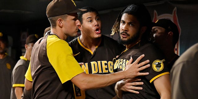 Manny Machado (13) and Fernando Tatis Jr. (23) of the San Diego Padres exchange words in the dugout during the fifth inning against the St. Louis Cardinals at Busch Stadium on Sept. 18, 2021 in St Louis, Mo.