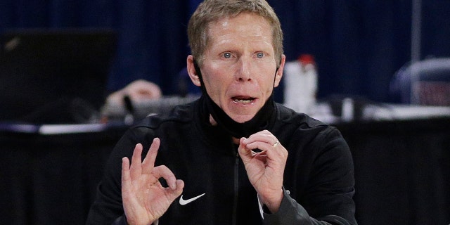 FILE - In this Feb. 25, 2021, file photo, Gonzaga coach Mark Few signals to players during the second half of an NCAA college basketball game against Santa Clara in Spokane, Wash. Few has been cited for driving under the influence. The Coeur d’Alene Press and Spokesman-Review acquired a police report through a public information request that says Few was stopped Monday evening, Sept. 6, after he was "called in as driving erratic and speeding." (AP Photo/Young Kwak, File)
