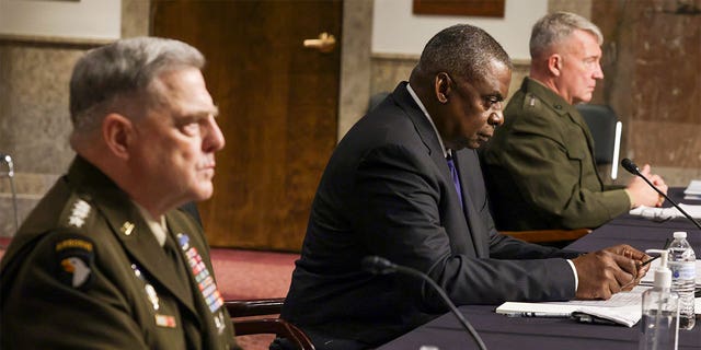 WASHINGTON, DC - SEPTEMBER 28: U.S. Secretary of Defense Lloyd Austin (C) Chairman of the Joint Chiefs of Staff Gen. Mark Milley (L) and Commander of U.S. Central Command Gen. Kenneth McKenzie (R) testify during a hearing before Senate Armed Services Committee at Dirksen Senate Office Building September 28, 2021 on Capitol Hill in Washington, DC. The committee held the hearing "to receive testimony on the conclusion of military operations in Afghanistan and plans for future counterterrorism operations." (Photo by Alex Wong/Getty Images)
