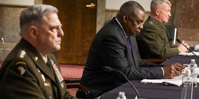 WASHINGTON, DC - SEPTEMBER 28: U.S. Secretary of Defense Lloyd Austin (C) Chairman of the Joint Chiefs of Staff Gen. Mark Milley (L) and Commander of U.S. Central Command Gen. Kenneth McKenzie (R) testify during a hearing before Senate Armed Services Committee at Dirksen Senate Office Building September 28, 2021 on Capitol Hill in Washington, DC. The committee held the hearing "to receive testimony on the conclusion of military operations in Afghanistan and plans for future counterterrorism operations." (Photo by Alex Wong/Getty Images)