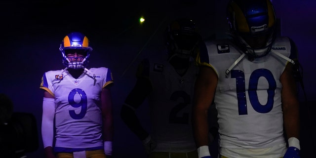 Los Angeles Rams quarterback Matthew Stafford ( 9 ) waits alongside wide receiver Cooper Kupp ( 10 ) before an NFL football game against the Chicago Bears, Sunday, Sept. 12, 2021, in Inglewood, Calif. (AP Photo/Marcio Jose Sanchez)