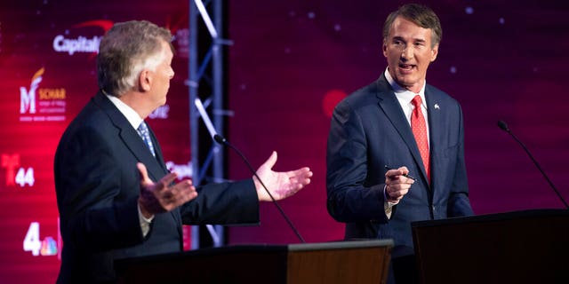 Virginia Democratic gubernatorial candidate and former Gov. Terry McAuliffe, left, and Republican nominee, Glenn Youngkin, participate in their debate at Northern Virginia Community College, in Alexandria, Va., Tuesday, Sept. 28, 2021. (AP Photo/Cliff Owen)