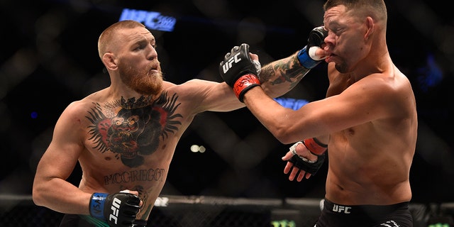 Nate Diaz fights Conor McGregor of Ireland in their welterweight bout during the UFC 202 event at T-Mobile Arena on August 20, 2016 in Las Vegas, Nevada.