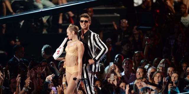 Miley Cyrus and Robin Thicke perform onstage during the 2013 MTV Video Music Awards at the Barclays Center on August 25, 2013 in the Brooklyn borough of New York City.