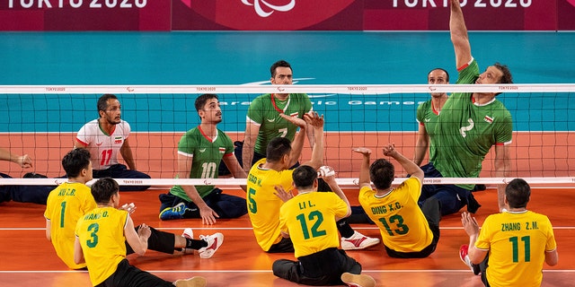 Iran's Morteza Mehrzadselakjani spikes the ball during the Men's Preliminaries Pool B Sitting Volleyball China against Iran during the Tokyo 2020 Paralympic Games in Tokyo, 화요일, 8월. 31, 2021. (Joe Toth for OIS via AP)