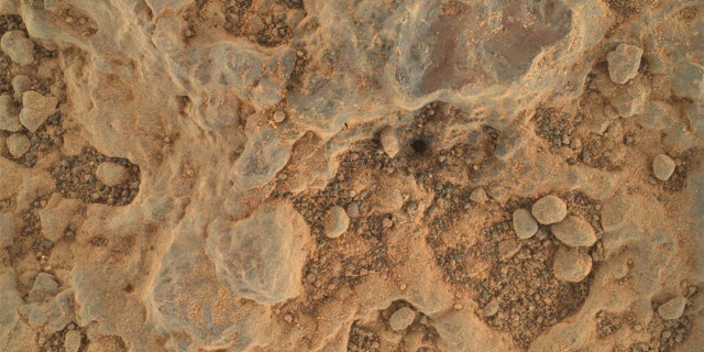 Perseverance took this close-up of a rock target nicknamed "Foux" using its WATSON camera on July 11, 2021, the 139th Martian day, or sol, of the mission. The area within the camera is roughly 1.4 by 1 inches (3.5 centimeters by 2.6 centimeters).