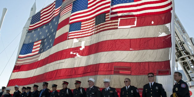 The National 9/11 Flag was raised over the Rocket Garden at the Kennedy Space Center Visitor Complex after Florida's contribution was added.