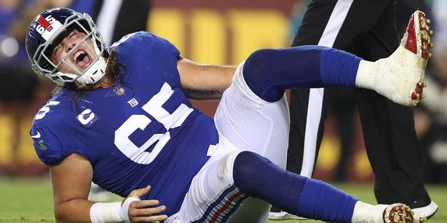 Nick Gates (65) of the New York Giants reacts following an injury during the first quarter against the Washington Football Team at FedEx Field Sept. 16, 2021, in Landover, Md. 