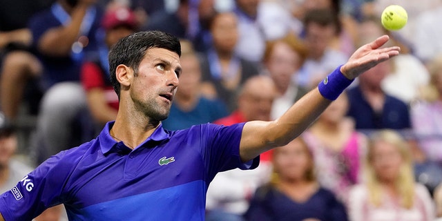 Novak Djokovic, of Serbia, serves against Jenson Brooksby, of the United States, during the fourth round of the U.S. Open tennis championships, Monday, Sept. 6, 2021, in New York. (AP Photo/John Minchillo)