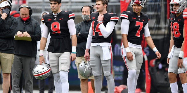 Quarterbacks Jack Miller III #9, Kyle McCord #14 and C.J. Stroud #7, all of the Ohio State Buckeyes watch their teammate during the Spring Game at Ohio Stadium on April 17, 2021 in Columbus, Ohio.