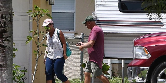 North Port, FL  - The parents of Brian Laundrie arrive back at their North Port home Tuesday, September 17, hours after an officer arrived at the home and left a pink notice at their door. Laundrie's parents are reportedly refusing to let their son talk to authorities in connection with the disappearance of his girlfriend, Gabby Petito, 22. 