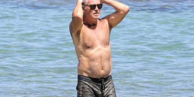 Pierce Brosnan went shirtless during a trip to the beach in Hawaii.