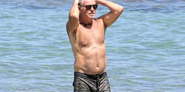 Pierce Brosnan went shirtless during a trip to the beach in Hawaii.