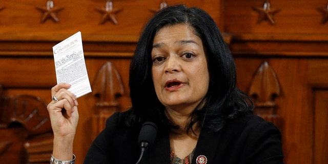 Holding up a copy of the U.S. Constitution, Rep. Pramila Jayapal, D-Wash., votes to approve the second article of impeachment as the House Judiciary Committee holds a public hearing to vote on the two articles of impeachment against U.S. President Donald Trump in the Longworth House Office Building on Capitol Hill Dec. 13, 2019 in Washington, D.C.