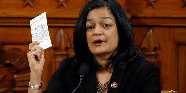 Holding up a copy of the U.S. Constitution, Rep. Pramila Jayapal, D-Wash., votes to approve the second article of impeachment as the House Judiciary Committee holds a public hearing to vote on the two articles of impeachment against U.S. President Donald Trump in the Longworth House Office Building on Capitol Hill Dec. 13, 2019 in Washington, D.C.