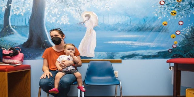Rachael DiFransico, in the Ohio clinic’s waiting room, said she wanted ‘our best shot at getting the vaccine as quickly as possible’ for Sybil, who is 14 months old.