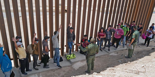 Aug 15, 2021: Migrants attempting to cross in to the U.S. from Mexico are detained by U.S. Customs and Border Protection at the border in San Luis, Arizona.