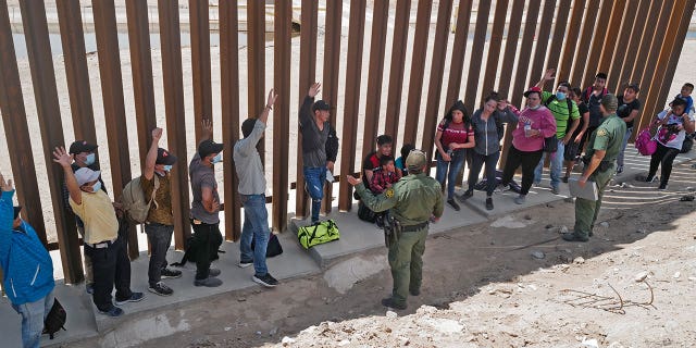 Migrants attempting to cross to the U.S. from Mexico are detained by U.S. Customs and Border Protection (CBP) at the border on August 15, 2021 in San Luis, Arizona.