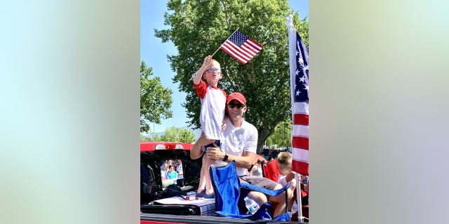 Rep. Moore and his son Winnie at the Kaysville Independence Day parade 