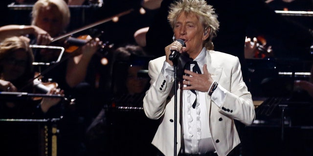 In this Feb. 18, 2020 file photo, Rod Stewart performs on stage at the Brit Awards 2020 in London. A Florida judge on Thursday, Sept. 9, 2021, has canceled the trial for Stewart and his adult son and scheduled a hearing next month to discuss a plea deal to resolve misdemeanor charges. The singer of 70s hits such as "Da Ya Think I’m Sexy?" and "Maggie May" and his son are accused of pushing and shoving a security guard at an upscale hotel because he wouldn’t let them into a New Year’s Eve party nearly two years ago.  