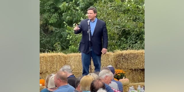 Republican Gov. Ron DeSantis of Florida takes aim at President Biden as he addresses the crowd at GOP Gov. Pete Ricketts of Nebraska's fifth annual Steak Fry, on Sunday Sept. 12, 2021 in Nebraska City, Nebraska.