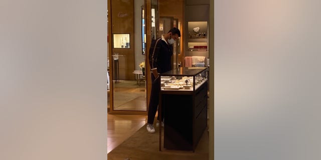 Britney Spears' hunky boyfriend, Sam Asghari, hits up Cartier in Beverly Hills to do a bit of ring shopping! Sam, 27, was very focused on the jewelry case. The woman brought out a diamond ring for Sam to get a closer look.