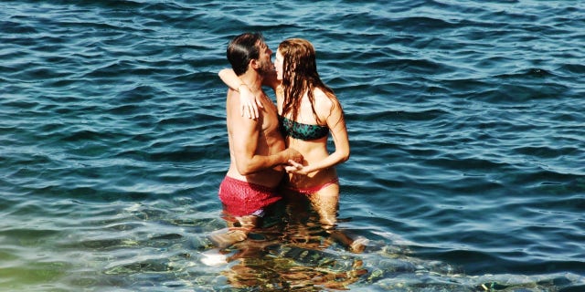 Jon Hamm with his girlfriend Anna Osceola taking a bath in the Mediterranean sea near Arco dell'Elefante in Pantelleria on Aug. 31.