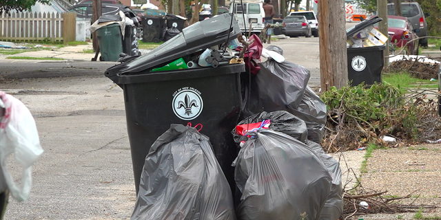 Trash bins in New Orleans are filled to the brim as city sanitation workers struggle to keep up with the demand for trash pick-up following Hurricane Ida.