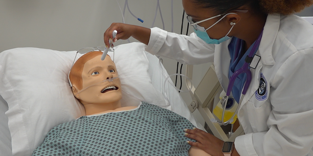 Senior level nursing student Stephania Long practices in the nursing skills lab at Notre Dame of Maryland University. (Jayla Whitfield/Fox News)