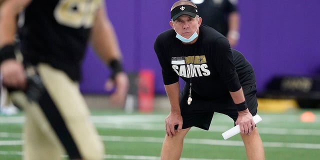 New Orleans Saints head coach Sean Payton looks on as players stretch during NFL football practice in Fort Worth, Texas, Wednesday, Sept. 15, 2021. (AP Photo/LM Otero)