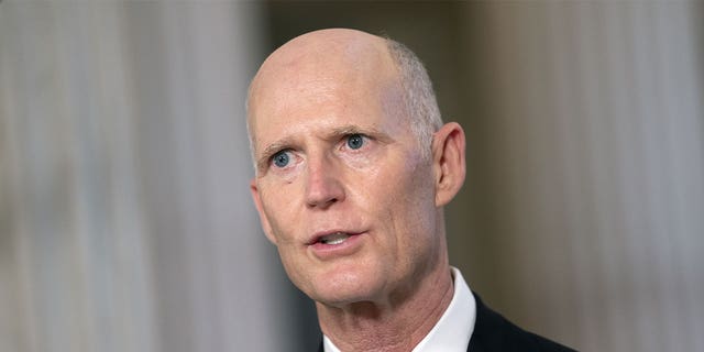 Sen. Rick Scott speaks during a television interview at the Russell Senate Office building in Washington on Nov. 11, 2020.
