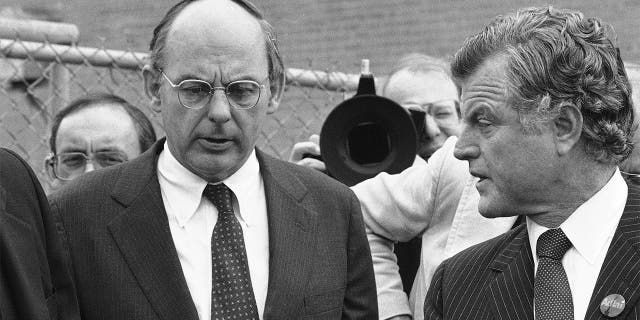 FILE - In this Oct. 14, 1982, file photo, Illinois Democratic gubernatorial candidate Adlai Stevenson III, left, talks with Sen. Edward Kennedy, right, talk as they finish a series of appearances in Chicago. Stevenson III, of Illinois, has died at his home on Chicago’s North Side. He was 90. On Tuesday, Sept. 7, 2021, his son Adlai Stevenson IV confirmed the Democrat’s death and said his father had dementia. (AP Photo/File)