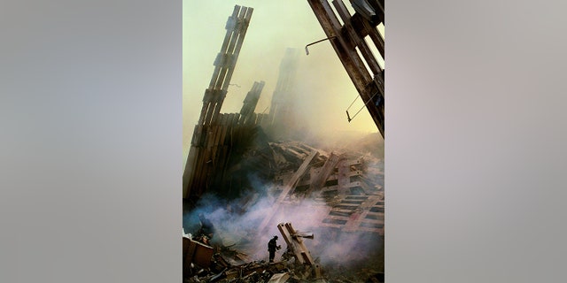 A firefighter uses a thermal imaging camera on 9/12/01.