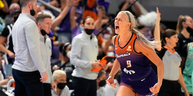 Phoenix Mercury guard Sophie Cunningham (9) reacts after scoring during the second half in the first round of the WNBA basketball playoffs against the Phoenix Mercury, Thursday, Sept. 23, 2021, in Phoenix. Phoenix won 83-82.