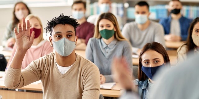 College students wear masks to protect themselves from coronavirus.