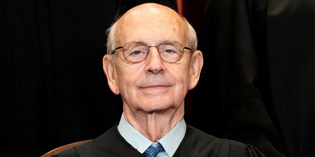 Associate Justice Stephen Breyer poses during a group photo of the justices at the Supreme Court in Washington, April 23, 2021.
