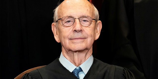 Associate Justice Stephen Breyer poses during a group photo of the justices at the Supreme Court in Washington, April 23, 2021.