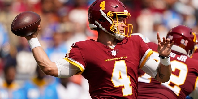 Washington Football Team quarterback Taylor Heinicke (4) throws the ball against the Los Angeles Chargers during the first half of an NFL football game, Sunday, Sept. 12, 2021, in Landover, Md. (AP Photo/Andrew Harnik)