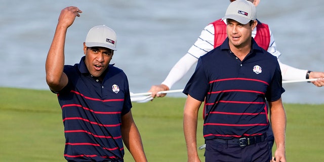 Team USA's Tony Finau responds after making a hole on the 13th hole during a four-ball game in the Ryder Cup at the Whistling Straits Golf Course on Friday, September 24, 2021, in Sheboygan, Wis. 