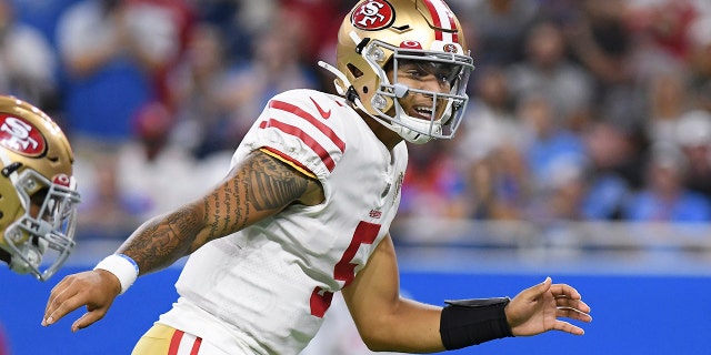 San Francisco 49ers quarterback Trey Lance signals at the line of scrimmage against the Detroit Lions In the first half of an NFL football game in Detroit, Sunday, Sept. 12, 2021. (AP Photo/Lon Horwedel)