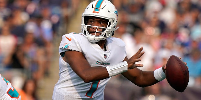 Miami Dolphins quarterback Tua Tagovailoa (1) looks to pass during the first half of an NFL football game against the New England Patriots, Sunday, Sept. 12, 2021, in Foxborough, Mass. (AP Photo/Steven Senne)