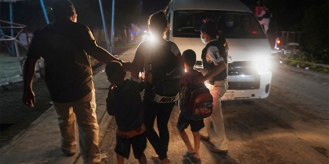 Mexican immigration agents detain a Central American migrant who is part of a caravan heading north in Huixtla, Mexico, Sept. 5, 2021. (Online News 72h Photo/Marco Ugarte)