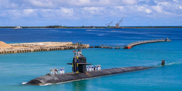 In this photo provided by the US Navy, the Los Angeles-class fast attack submarine USS Oklahoma City (SSN 723) returns to Naval Base Guam on August 19, 2021 (Mass Communication Specialist 3rd Class Naomi Johnson / US Navy via AP)